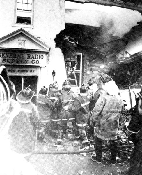 Scene depicts exterior operations at height of fire, March 1970