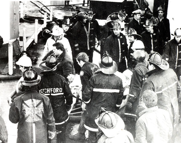 Captain Maycott carried to waiting ambulance after collapse rescue