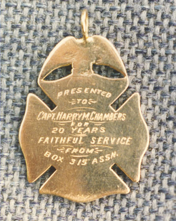 Medal presented to Captain Harry M. Chambers for 20 years faithful service from Box 315 Association