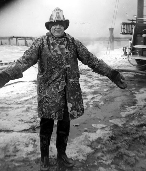 Captain Felix Bendzyn of Engine Company 8 encrusted in ice after fighting a fire at the foot of Clinton Street, winter of 1958