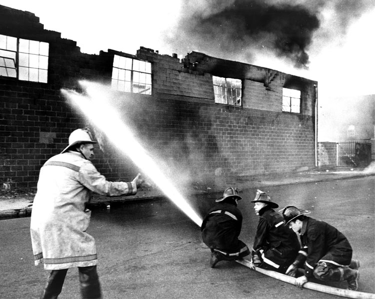 Chief James Asher directing firefighting operations at a Second Alarm fire, Spring 1966