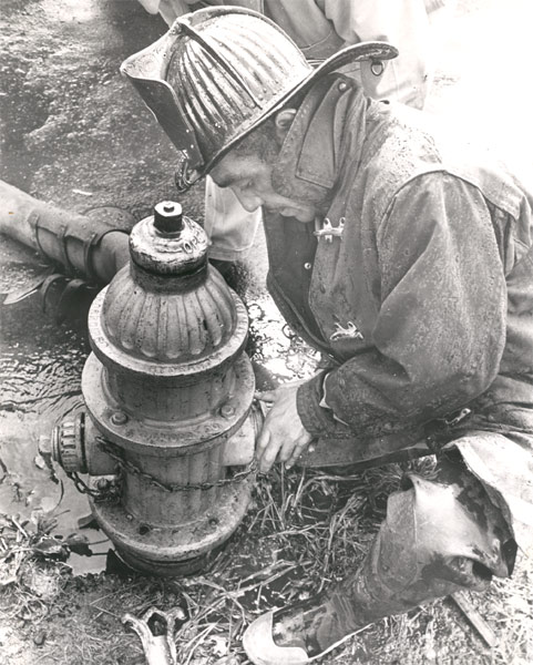 Robert Whitney, Camden firefighter, working at a fire hydrant