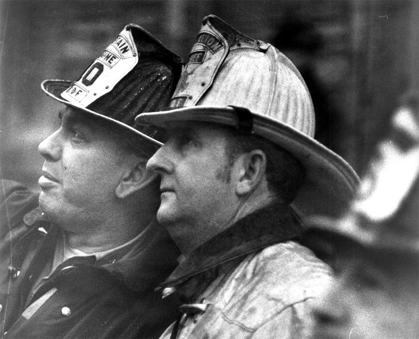 Captain Edward Brendlinger of Engine Company 10 with Battalion Chief Thomas McCabe at Fourth alarm fire, South Camden, 1971