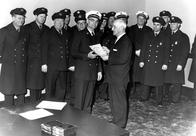 Director of Public Safety Edward Garrity presents Chief Edward MacDowell with a municipal proclamation, Camden Fire Department