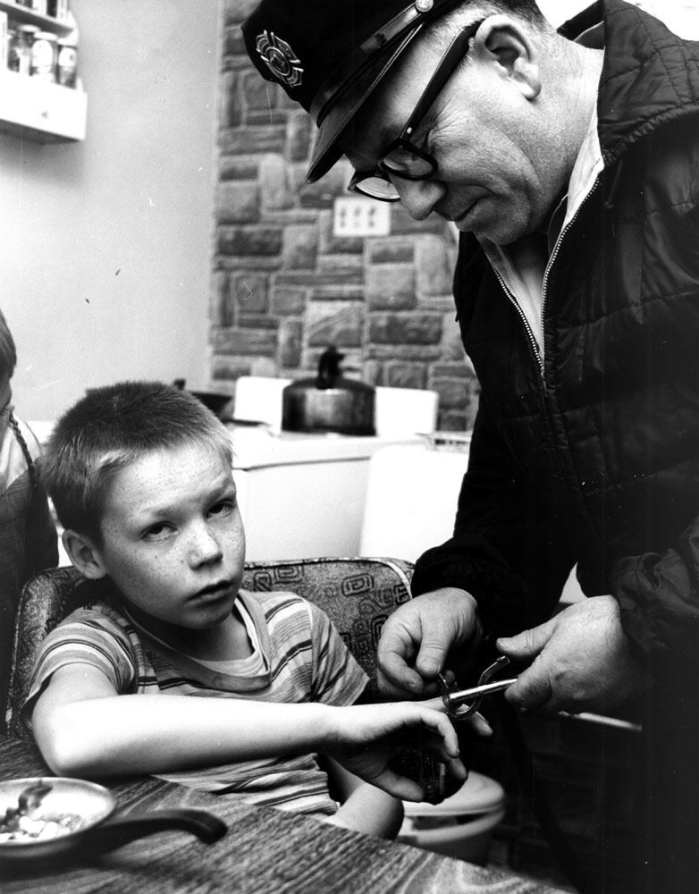 Fireman Ernest Tartaglia using a ring cutter, circa 1965