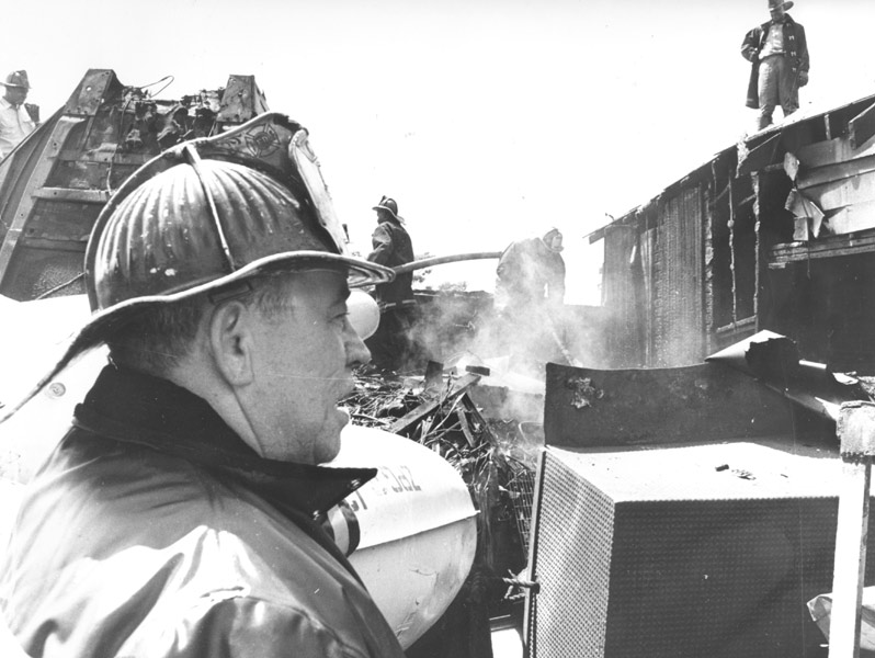 Captain Arthur C. Batten with Rescue Company 1 at a junkyard fire, South 6th Street and Chestnut Street, June 1964