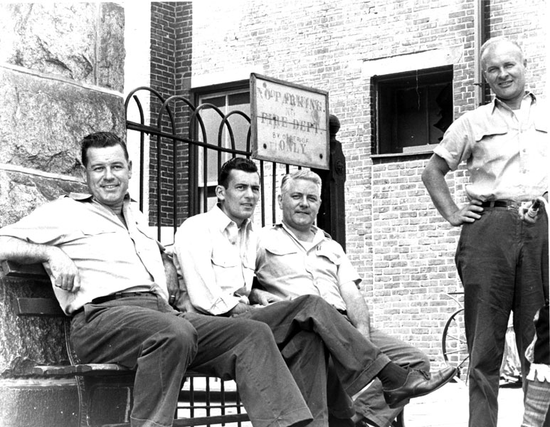 Firemen Raymond Banford, James McGrory, James Stewart, and Chester Gedrich in front of a fire station