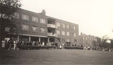 Crowd in front of Building 22, 3159 Westfield Avenue, during patriotic exercises, July 4, 1941
