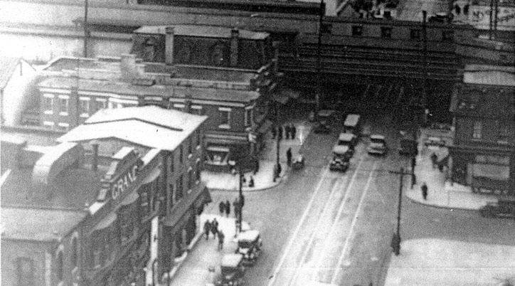 Broadway and Mickle Street, looking northwest from the Stevens Building, 1936, showing the elevated Chinese Wall railroad tracks