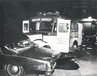 Wrecked automobile and Rescue Company 1 apparatus after being righted, December 9, 1967