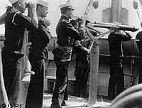 USS DeKalb fire control bridge scene with officer and sailor, 18 May 1918