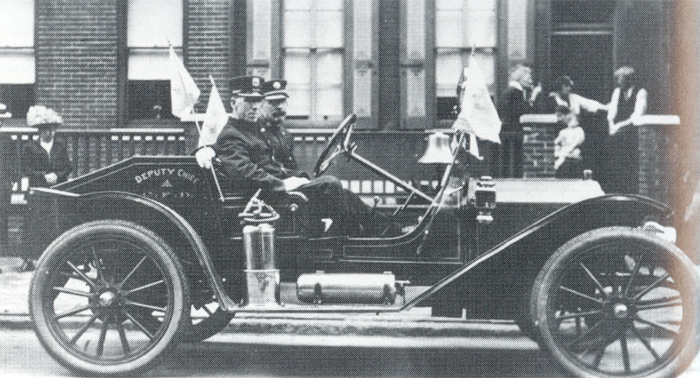 Deputy Chief William Patterson with aide fireman Martin Carrigan in 1914 Buick