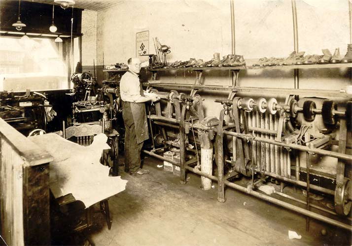 Jacob Leon at work in his shoe repair shop at 1006 North 27th Street, Camden