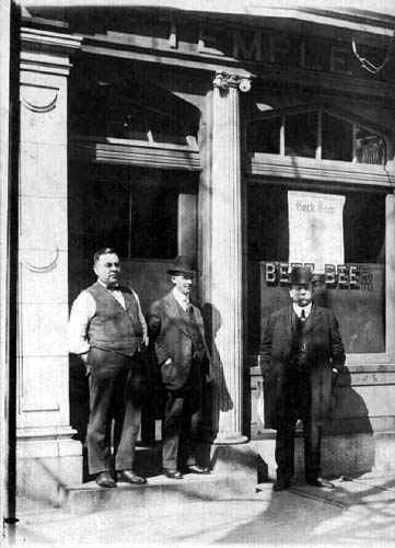 Edward Gondolff (far left) standing in front of his bar