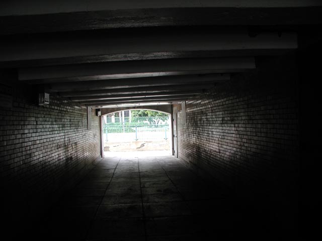Inside the 5th Street tunnel under the Ben Franklin Bridge, looking south, July 5, 2004. Note Rutgers University Building in the background.