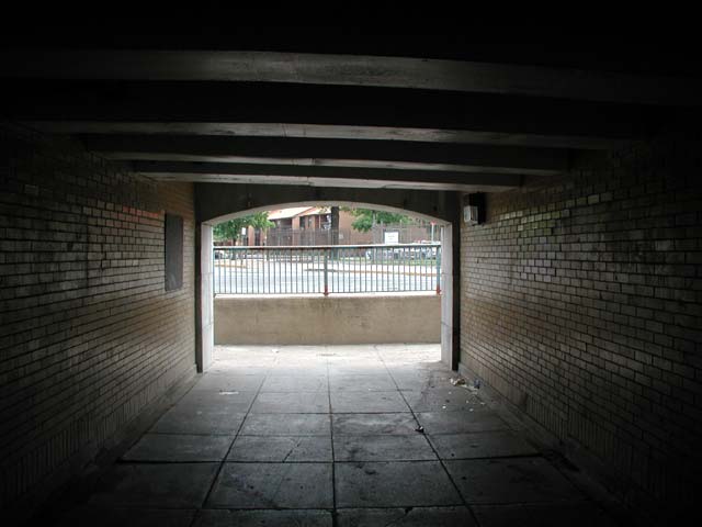 Inside the 5th Street tunnel under the Ben Franklin Bridge, looking north. Note Northgate townhouses in the background.