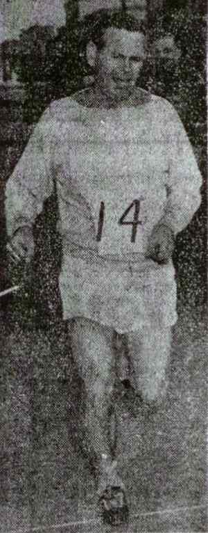 John Glazer running in a race, wearing number 14