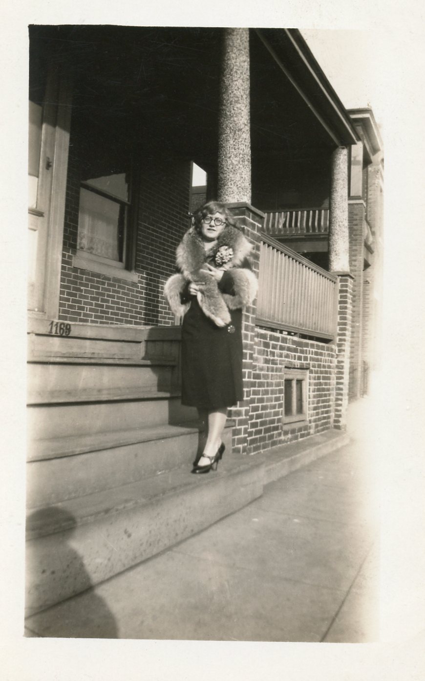 Cecelia Glazer in front of 1169 Van Hook Street, 1940s