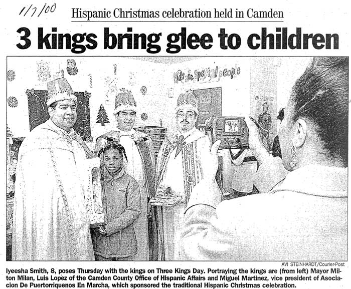 Camden Courier-Post photograph dated January 7, 2000, showing Iyeesha Smith, 8, posing with the three kings at McGuire Gardens: Mayor Milton Milan, Luis Lopez of the Camden County Office of Hispanic Affairs, and Miguel Martinez, vice president of Asociacion De Puertorriquenos En Marcha