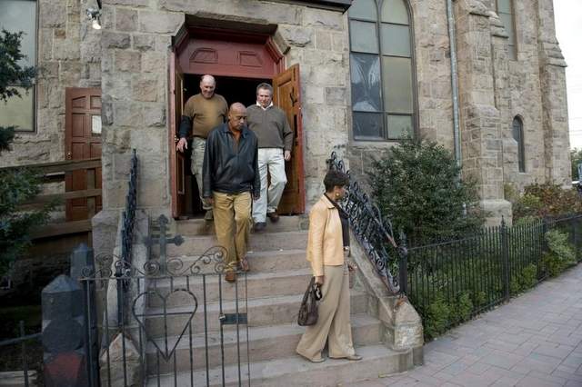 Mourners leave a viewing for Joe Balzano at Sacred Heart Church in Camden