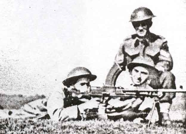 Private Herman at far left, firing a Bren light machine gun