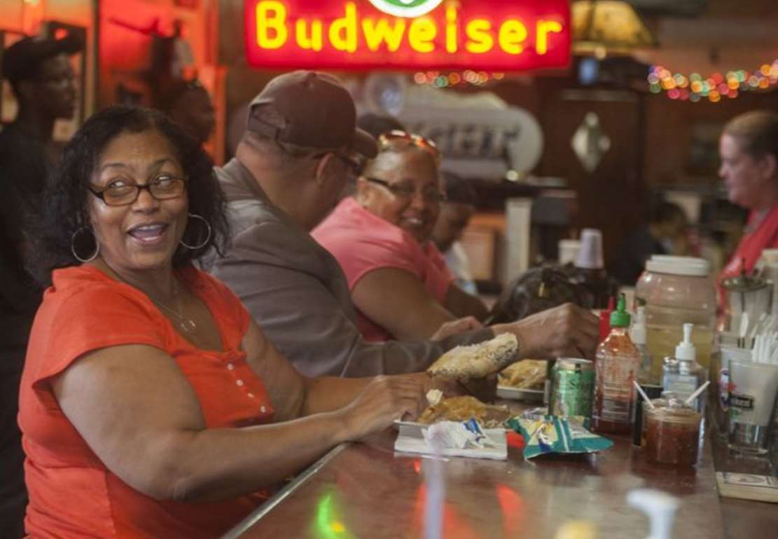 Carol Blalock tries a steak sandwich at Donkey's Place