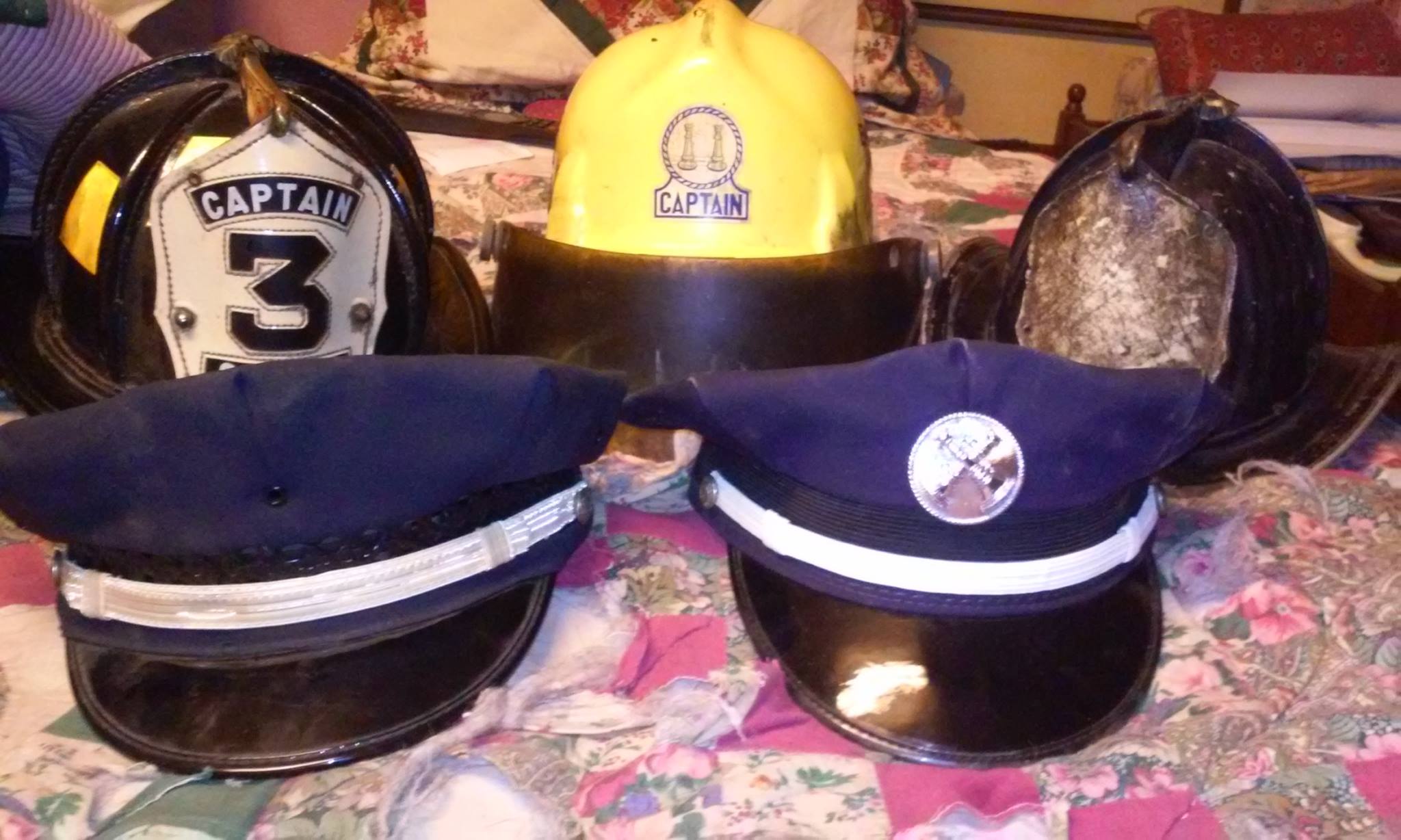 J. Stanley Wysocki with fire helmets