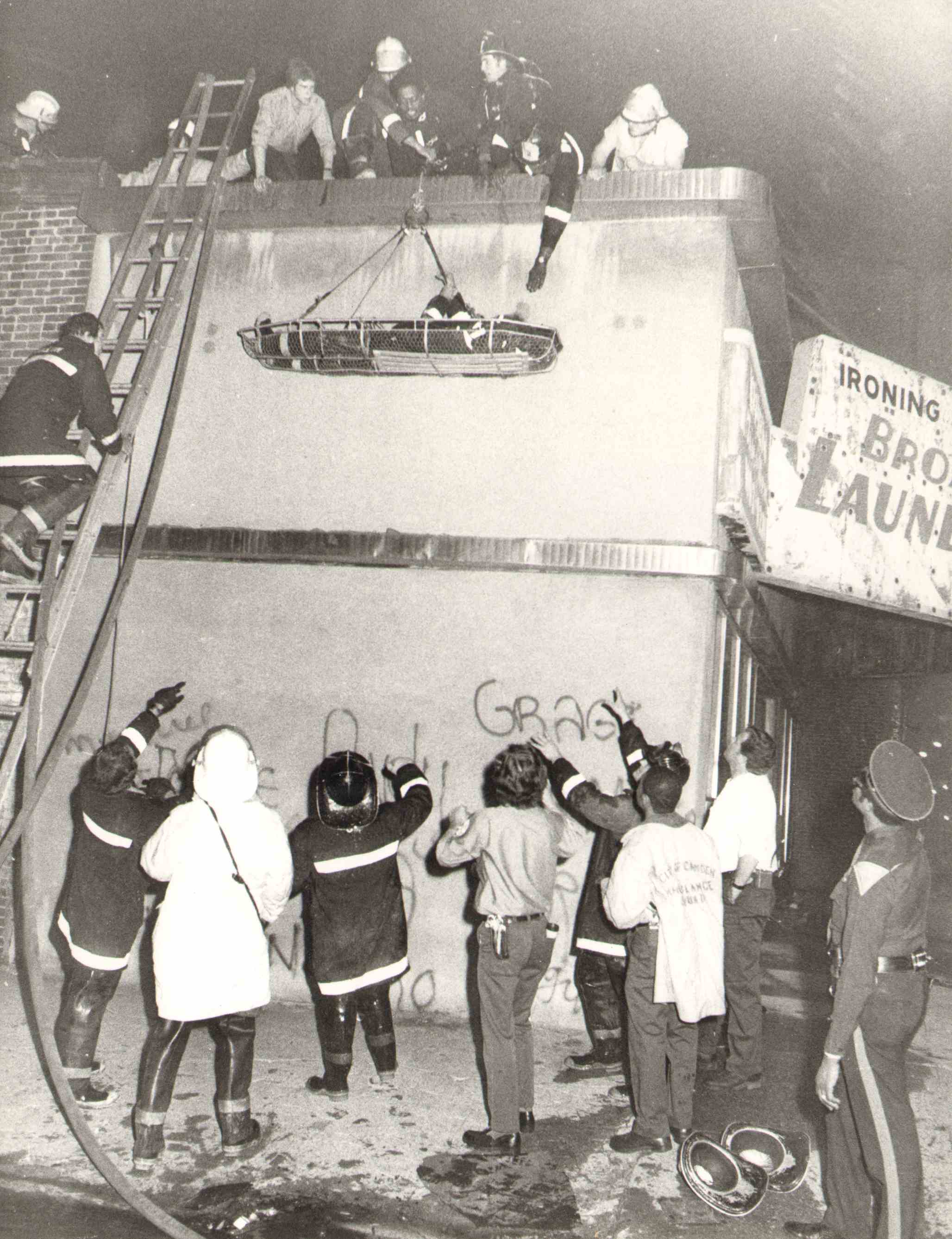 Injured Firefighter Larry Reed lowered in litter