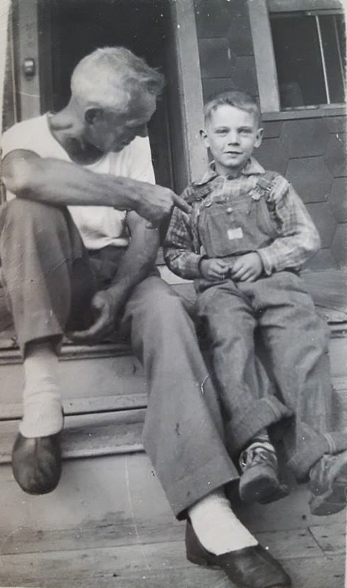 Young Norbert Sorensen with Camden Fire Department member John D. 'Jake' Huelas at 910 North 24th Street, circa 1948