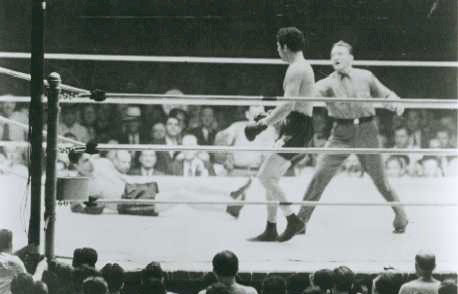 Max Baer stands over a downed Max Schmeling at Yankee Stadium, June 8, 1933