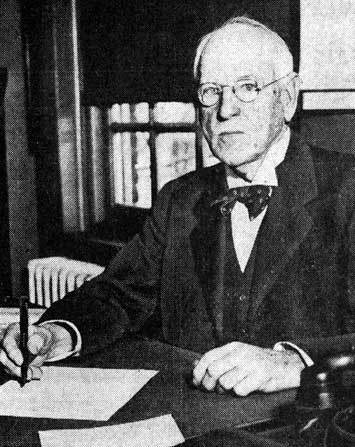 Former Justice Frank T. Lloyd at his new desk, February 1, 1938