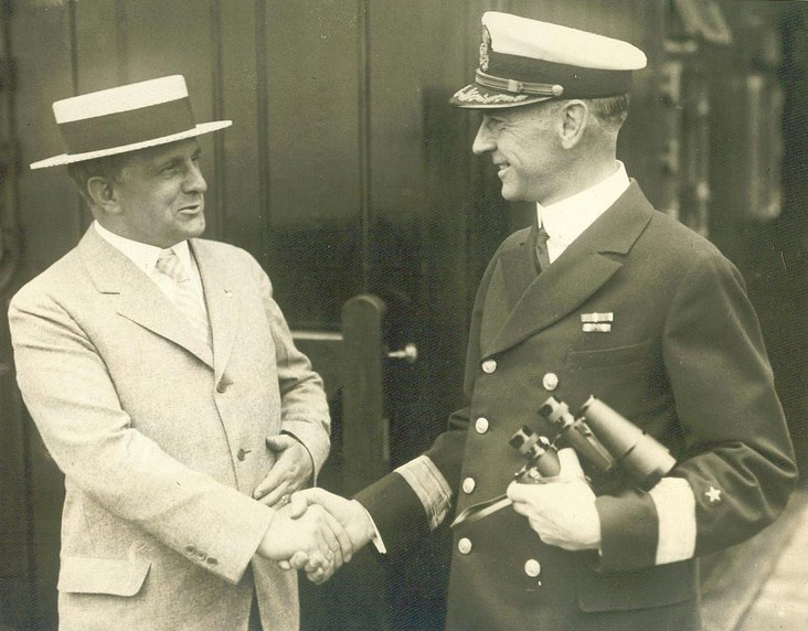 Secretary James J. Davis shaking hands with Commodore Herbert Hartley aboard the Leviathan, July 4, 1923