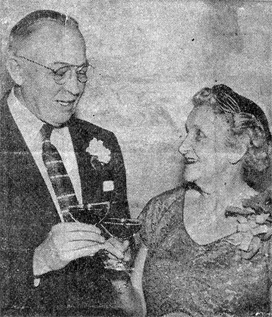 Mr. and Mrs. William B. Colsey Sr. offer an anniversary toast at a party in their honor at Kenney's, February 1957