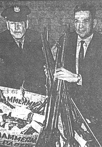 Lt. William Yeager and Sgt. William Schultz with confiscated weapons