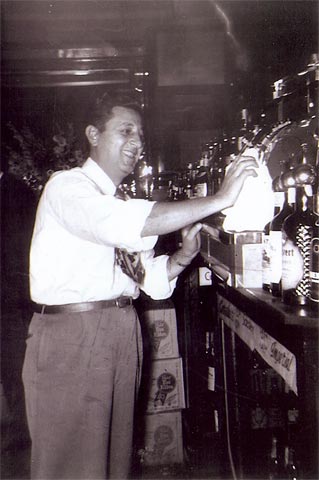 Nicholas La Maina behind the bar, 1939