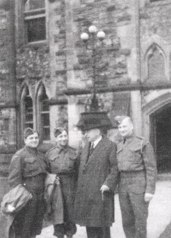 1943: Corporal Louis J. Herman, 2nd from left, standing next to Canadian Prime Minister William Lyon MacKenzie King outside the Parliament Building in Ottawa