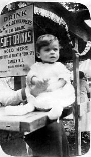 O. B. Weidenhammer booth at Fourth of July festivities at Pyne Point Park, July 4, 1923, with Carl W. Weber as an infant