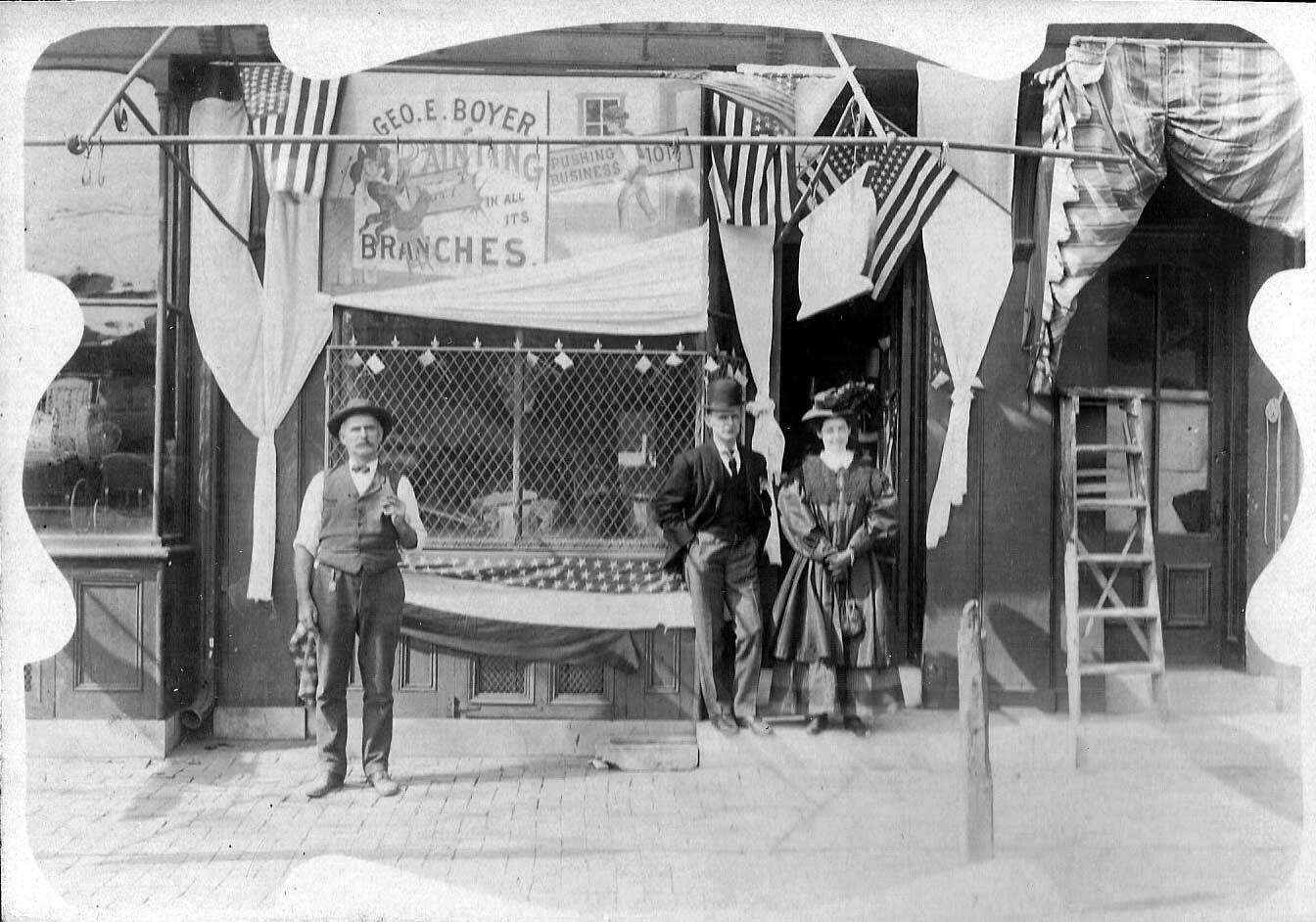 George E. Boyer advertising postcard, late 1890s to early 1900s. George E. Boyer at far left.