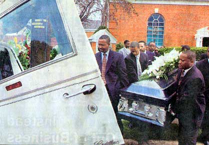 Pallbearers carry the casket of former Camden Mayor Arnold Webster after his funeral service at First Nazarene Baptist Church in Camden