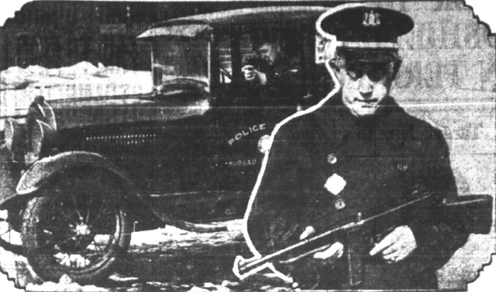 Captain Arthur Colsey with machine gun, Camden Courier-Post February 6, 1928