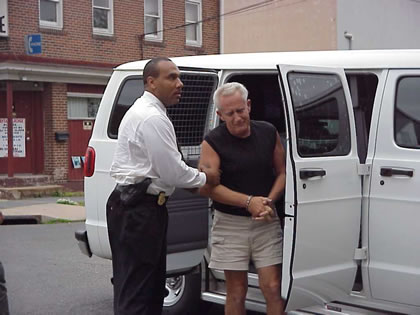 Interstate officer Michael Green returns Edward Solly to NJDOC custody at New Jersey State Prison