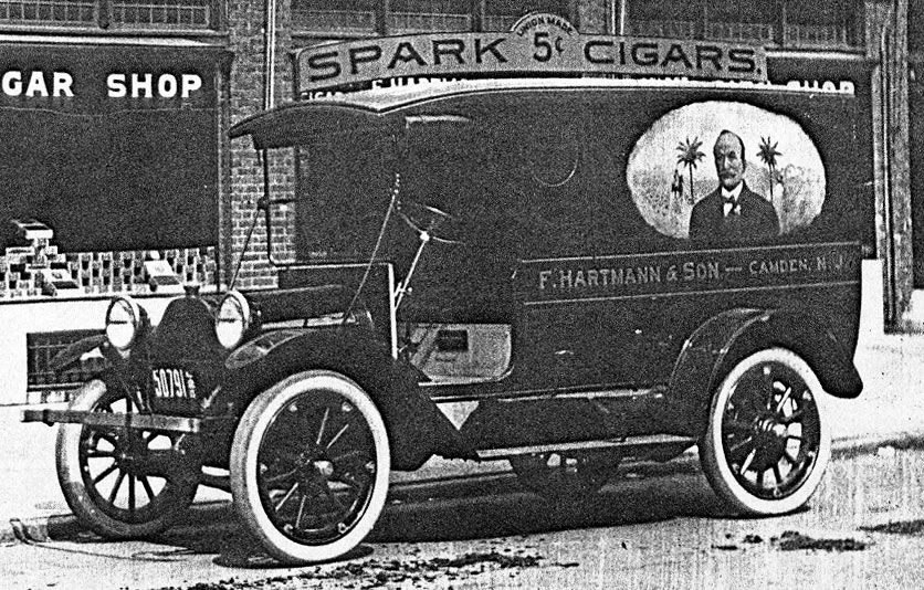 Spark Cigar Factory storefront with company truck, 1920s