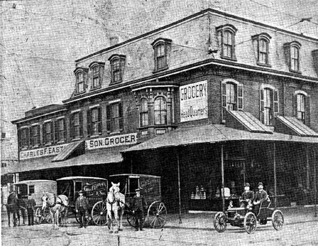 Charles F. Eastlack & Son Grocery store at Broadway and Walnut Street, Camden, with delivery wagons and first automobile