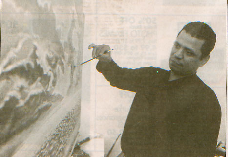 Pedro Fuller painting in his Camden home