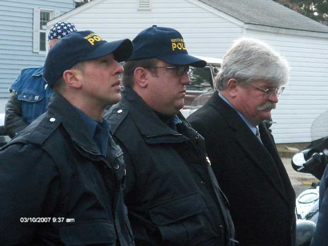 Rich Desmond on far left, without hat