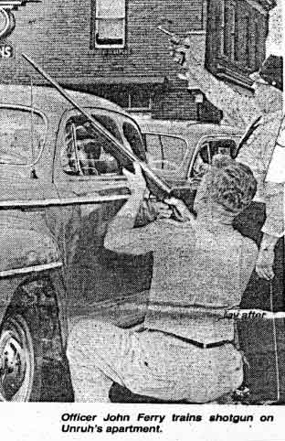 Officer John Ferry trains shotgun on Unruh's Apartment. Camden Courier-Post - September 7, 1974