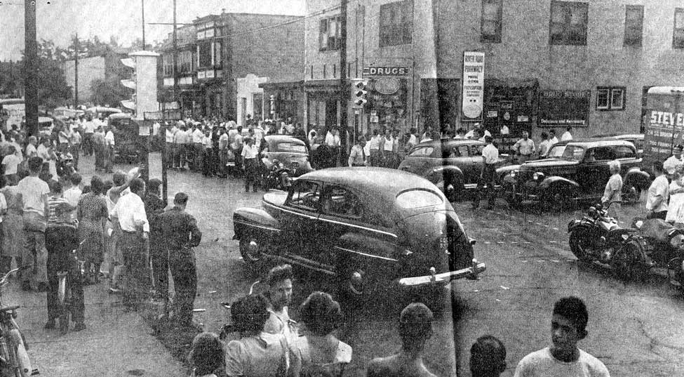 Immediately after Howard Unruh surrendered, River Road at 32d street becomes crowded with police and curiosity seekers. Minutes later Unruh sits perfectly calm in police wagon. Camden Courier-Post - September 7, 1974