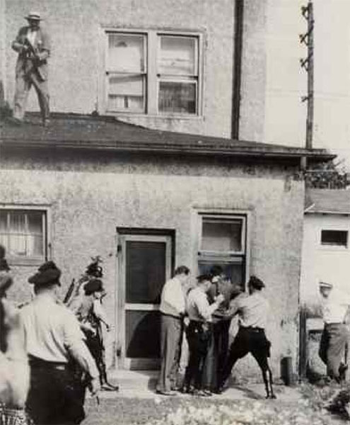 William Kelly on the roof of Unruh's apartment during his arrest. Camden Courier-Post - September 7, 1974