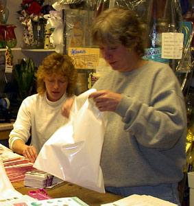 Missy Mauser and Darlene Timmons assembling Think Pink information packets, October 23, 2003