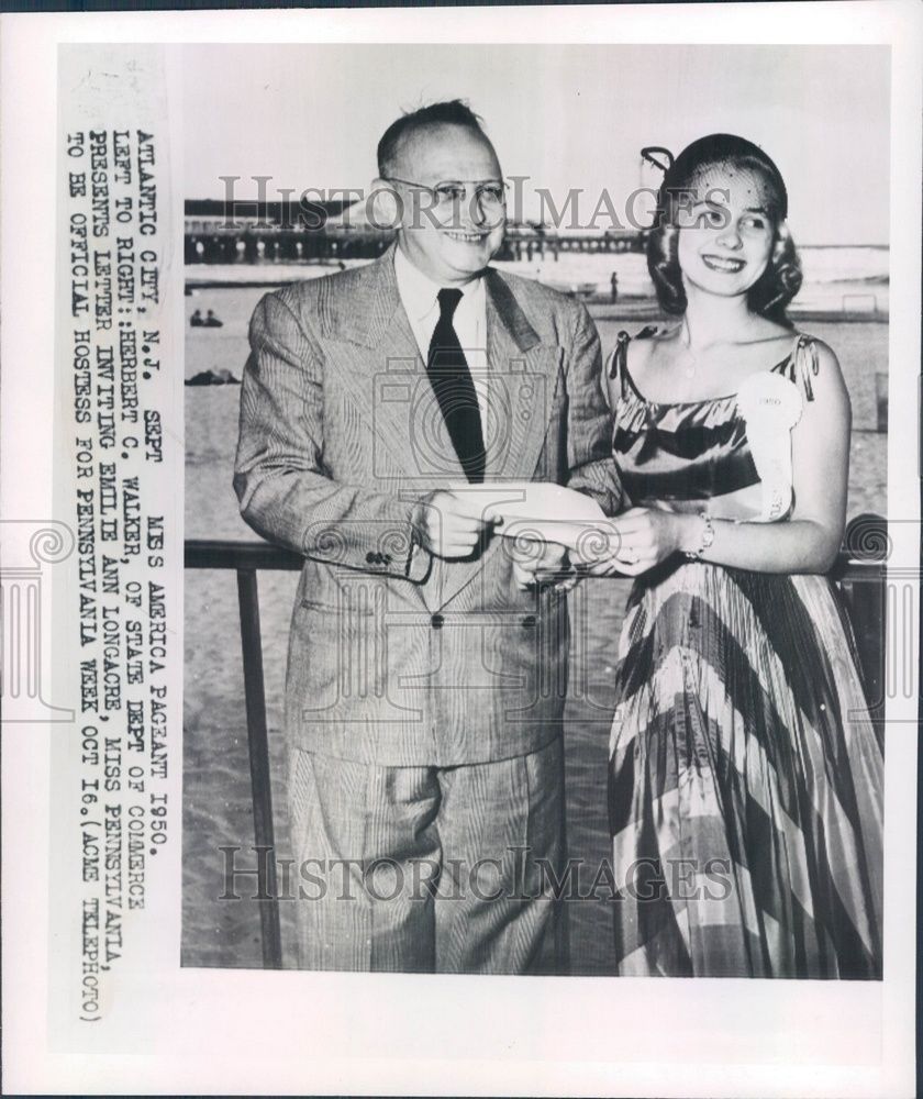 Herbert C. Walker of the State Dept. of Commerce presents a letter to Miss Pennsylvania Emilie Ann Longacre inviting her to be official hostess at the Miss America Pageant, Atlantic City, September 1950 — AP Wirephoto